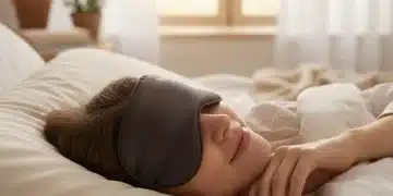 Person wearing a luxurious silk sleep mask in bed, emphasizing deep sleep and skin repair.