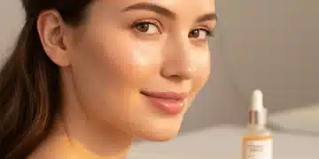 Woman with radiant glowing skin, showcasing the benefits of vitamin C serum.